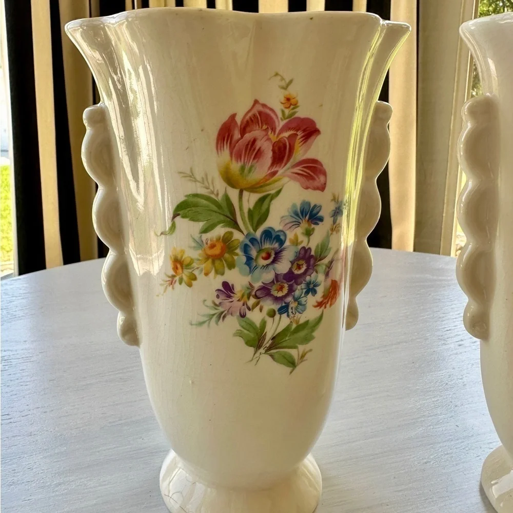 1950’S SET/2 , FLORAL VASES. SOFT CREAM COLOR WITH ONE SIDED FLORAL DESIGN.